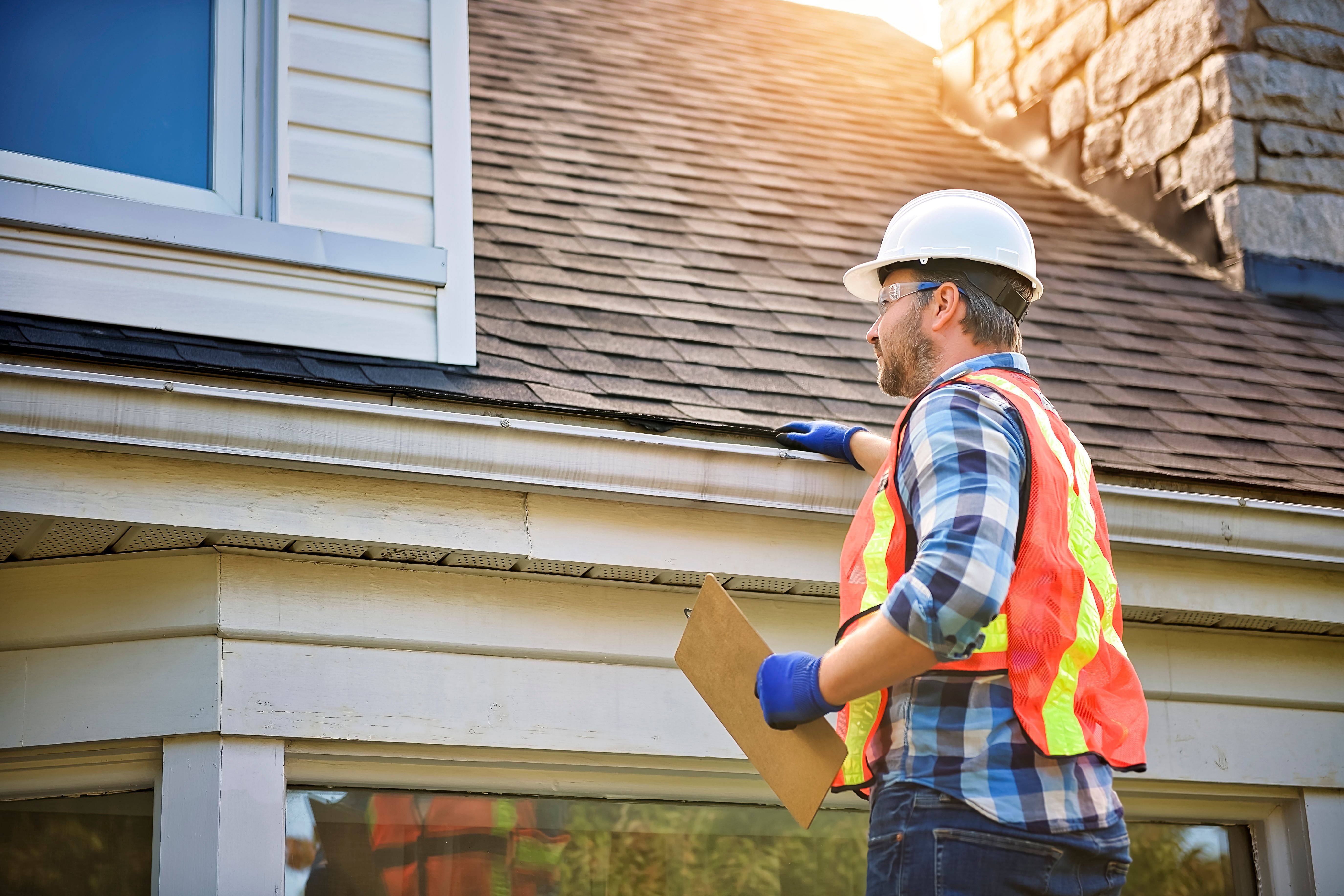 Home inspector checking exterior